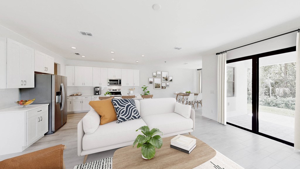 a living room with a white couch and a table