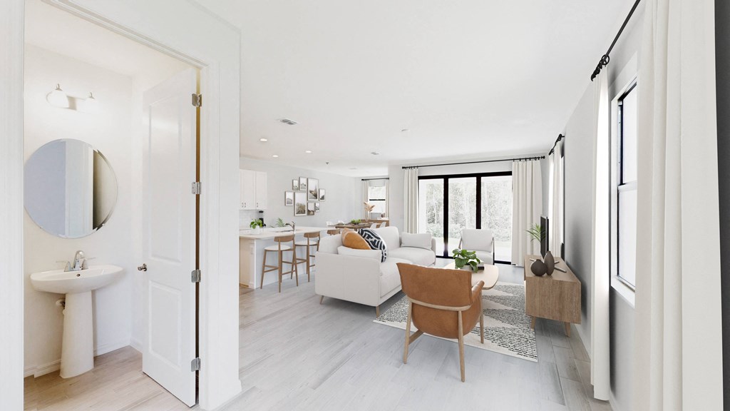a living room with a white couch and a table