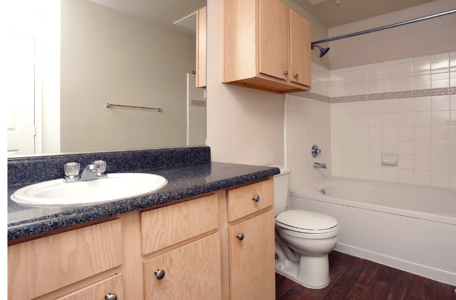 an empty bathroom with a sink toilet and bath tub