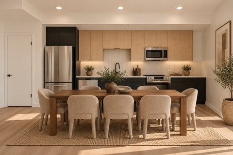 A modern kitchen with a dining table set for four.