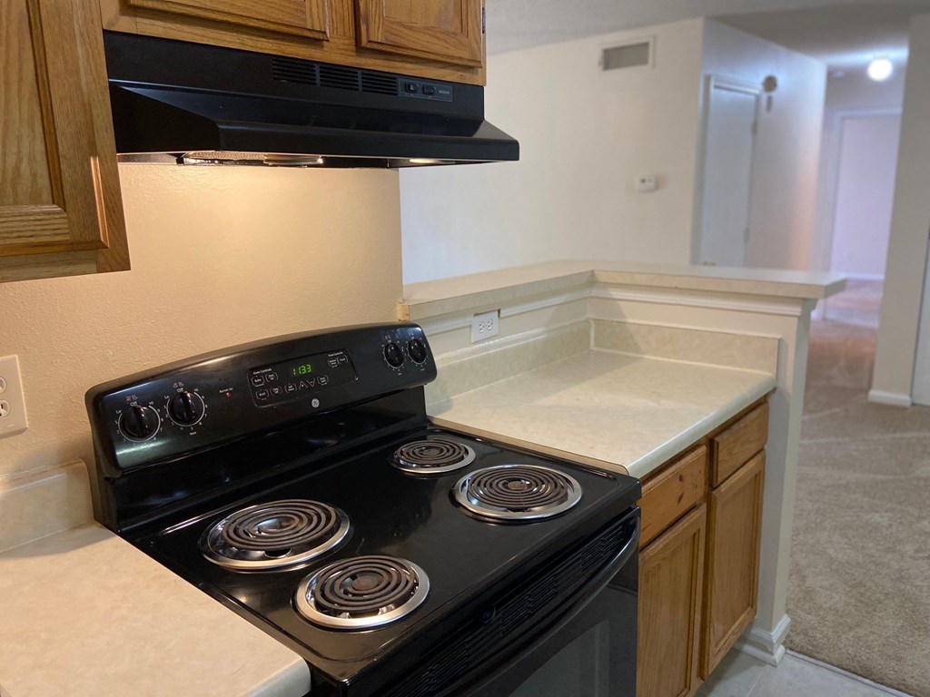 a kitchen with a stove and a sink