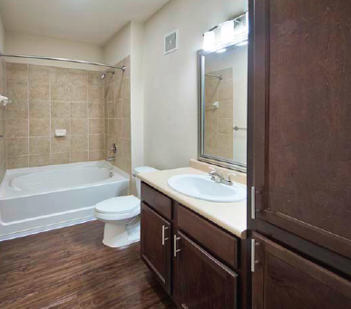 a bathroom with a sink toilet and a bath tub