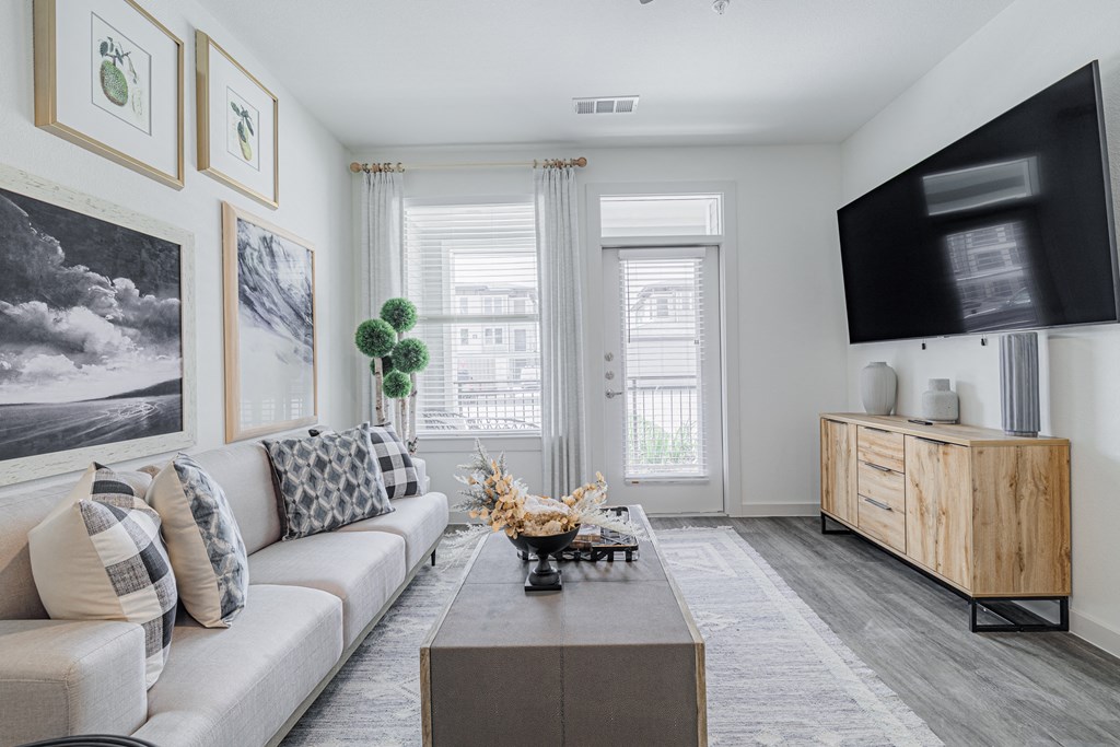 a living room with a couch and a tv