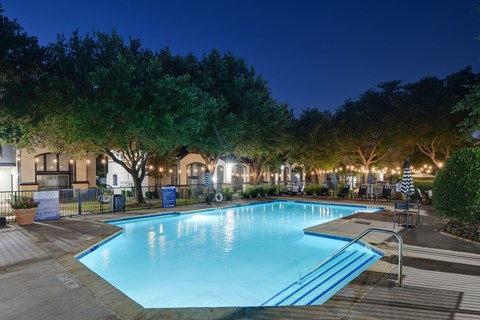 the swimming pool at night at the resort at longboat key club