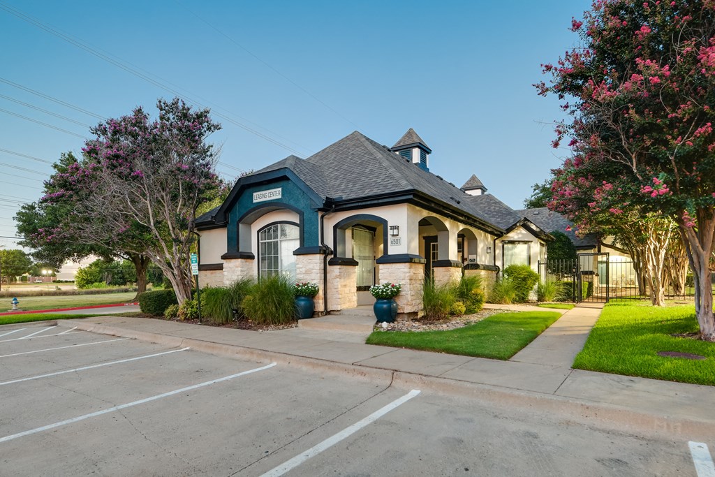 a house with a parking lot in front of it