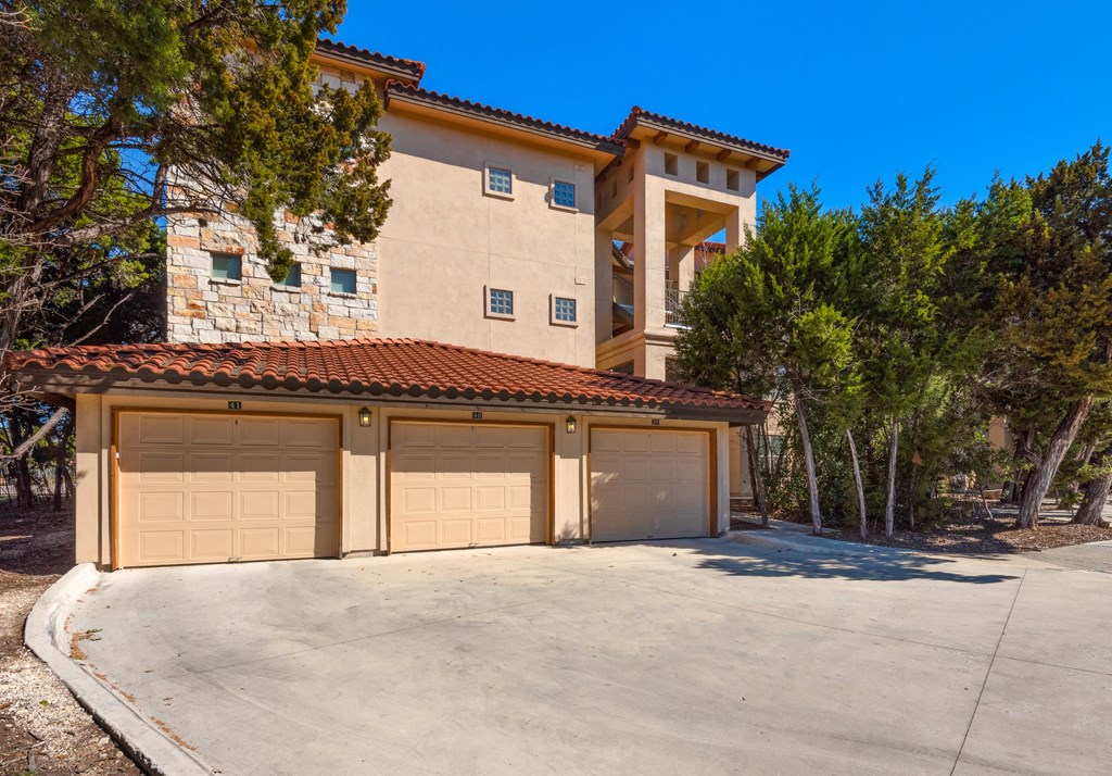 a garage with a two car garage door in front of a house