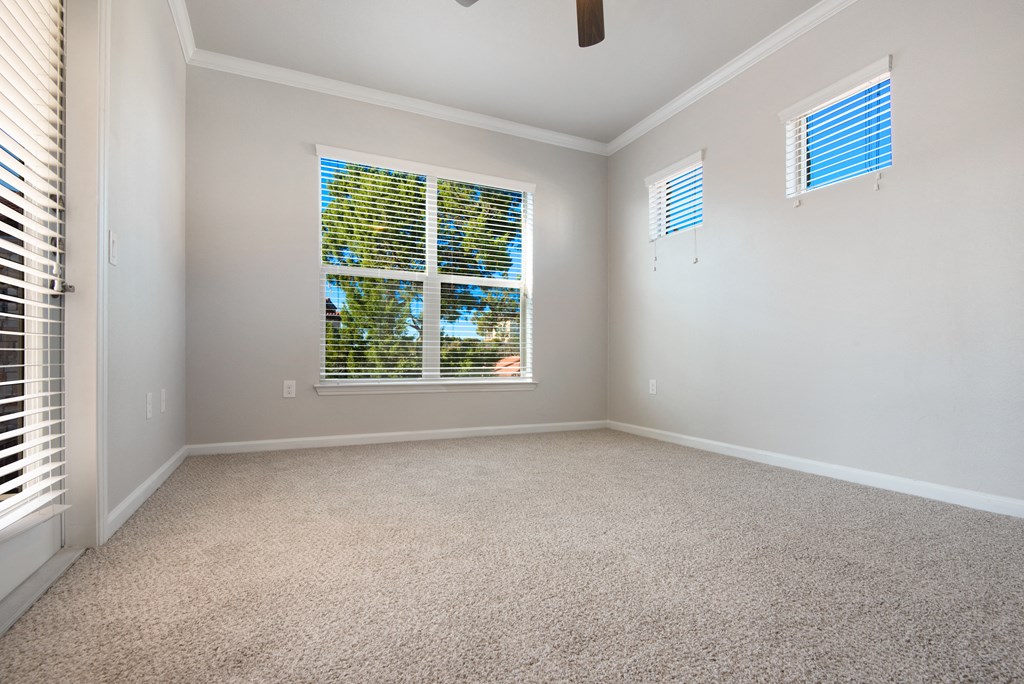 a bedroom with a large window