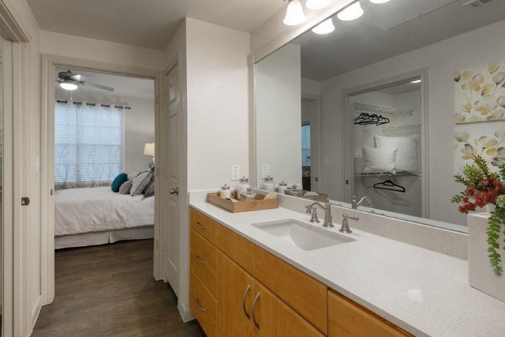bathroom with white counter tops