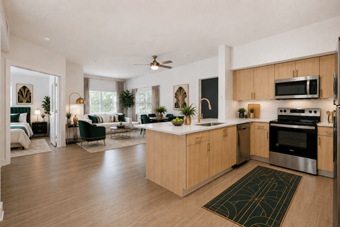 A modern kitchen with wooden cabinets and a large island.