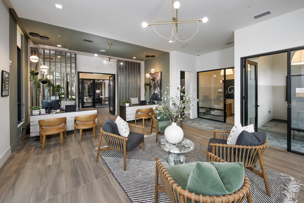 a living room with a table and chairs