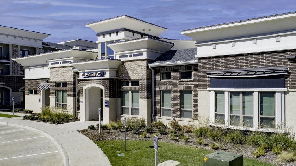 a group of townhomes are shown in front of a sidewalk and a street