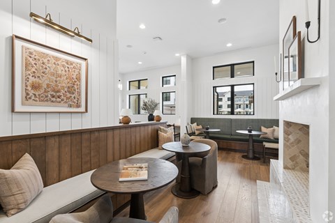 A modern dining area with a round table and chairs.