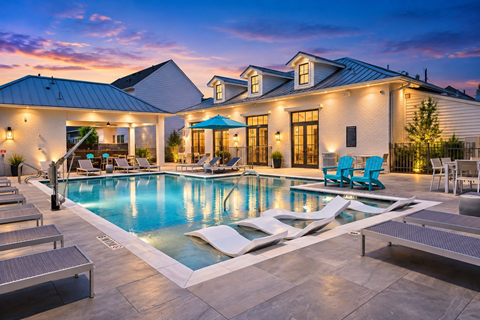 A large house with a pool in the backyard.