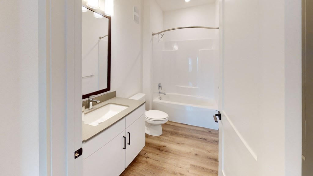 a bathroom with a toilet sink and bathtub