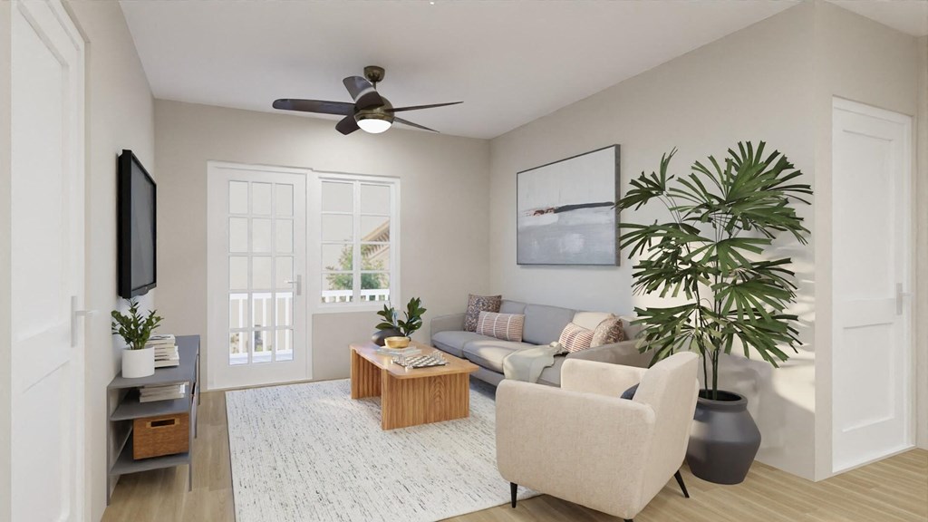 a living room with a couch and a ceiling fan