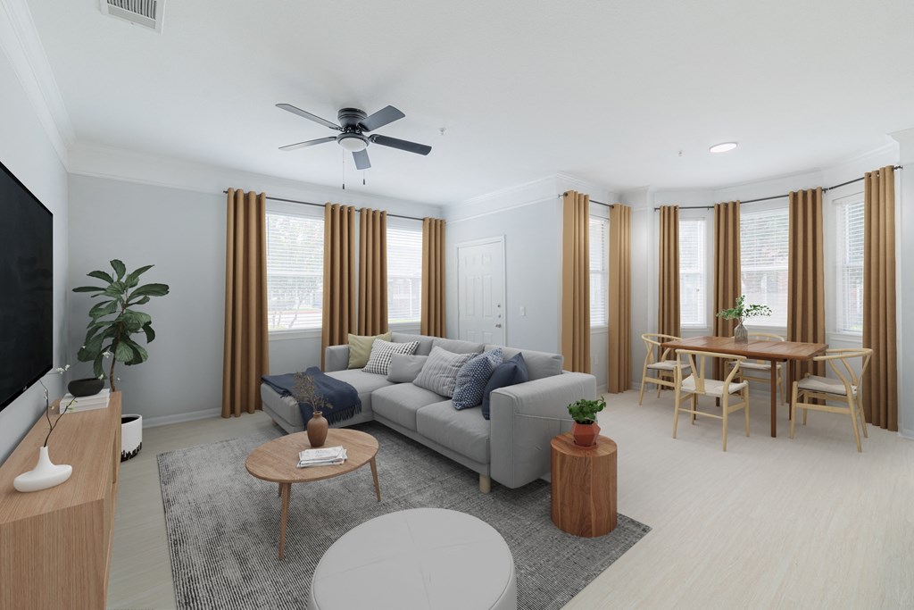 a living room and dining room with a couch and a table