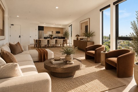 A living room with a large window and a view of the city.