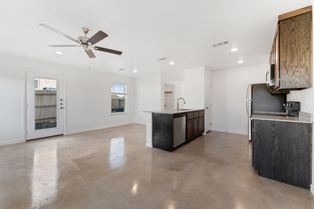a room with geometric patterns on the wall and a cabinet