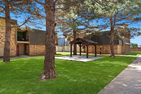 A building with a tree in front of it.