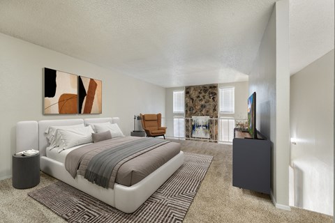 A bedroom with a large bed and a painting on the wall.