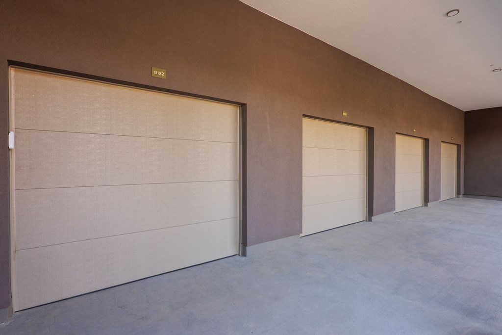A row of garage doors in a building.