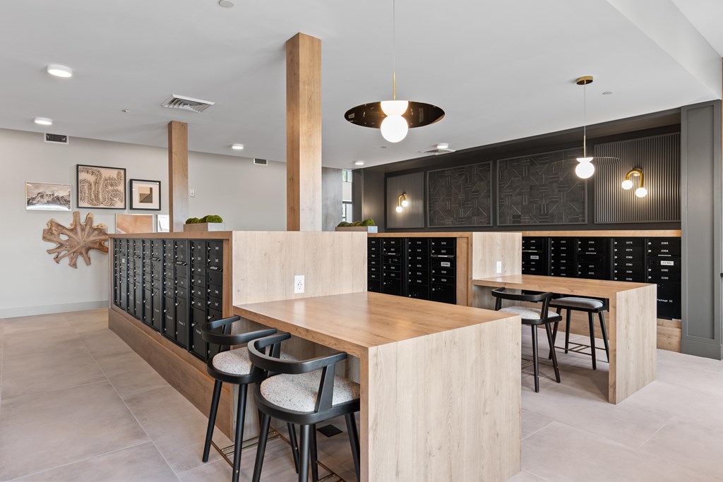 A modern kitchen with a wooden island and bar stools.