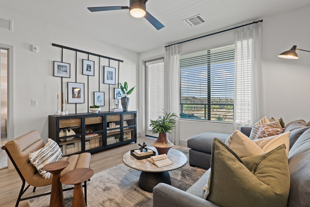 A living room with a brown chair and a coffee table.