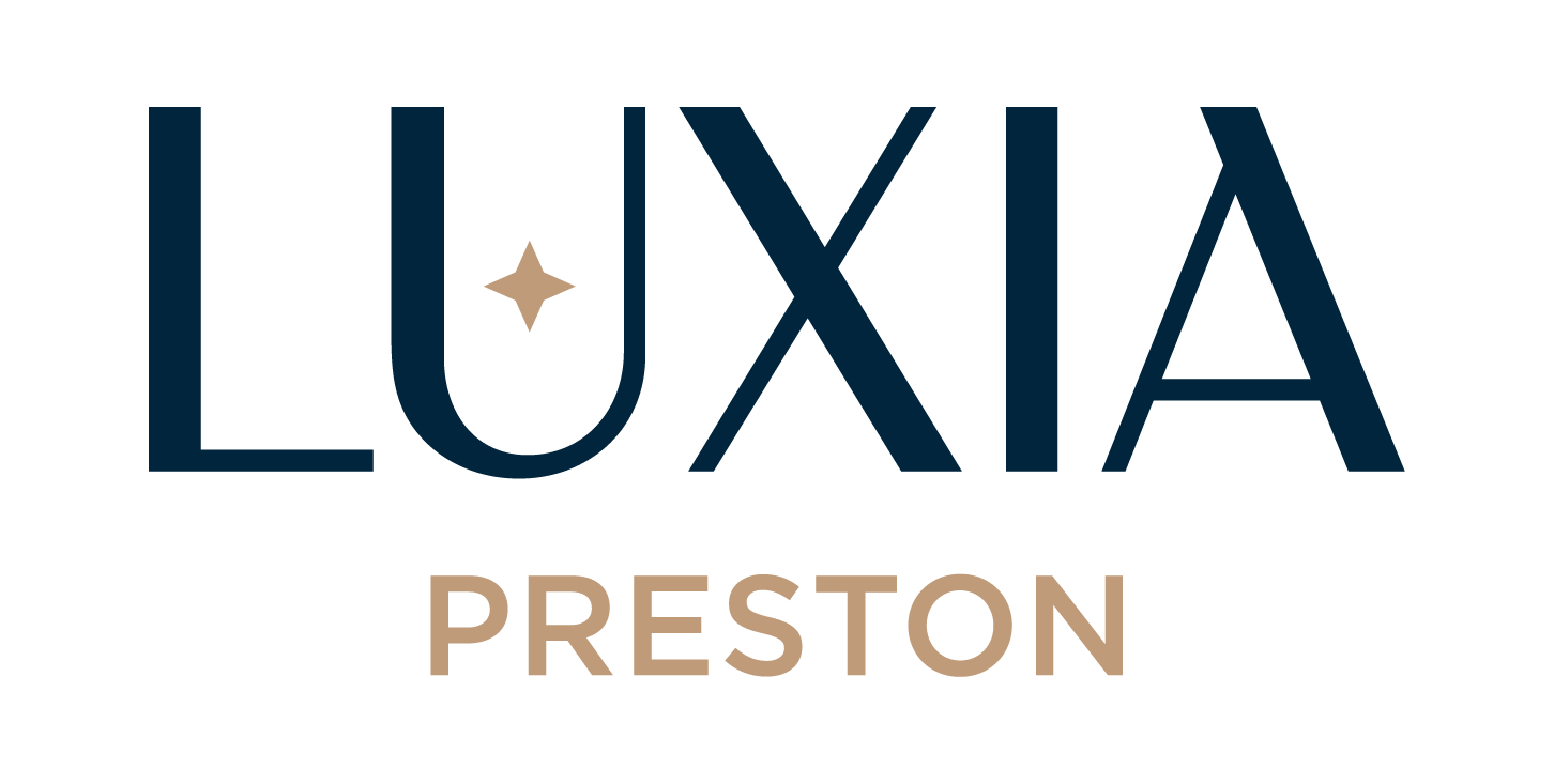 A logo with the word "LUXIA" in large letters and "PRESTON" in smaller letters below it.