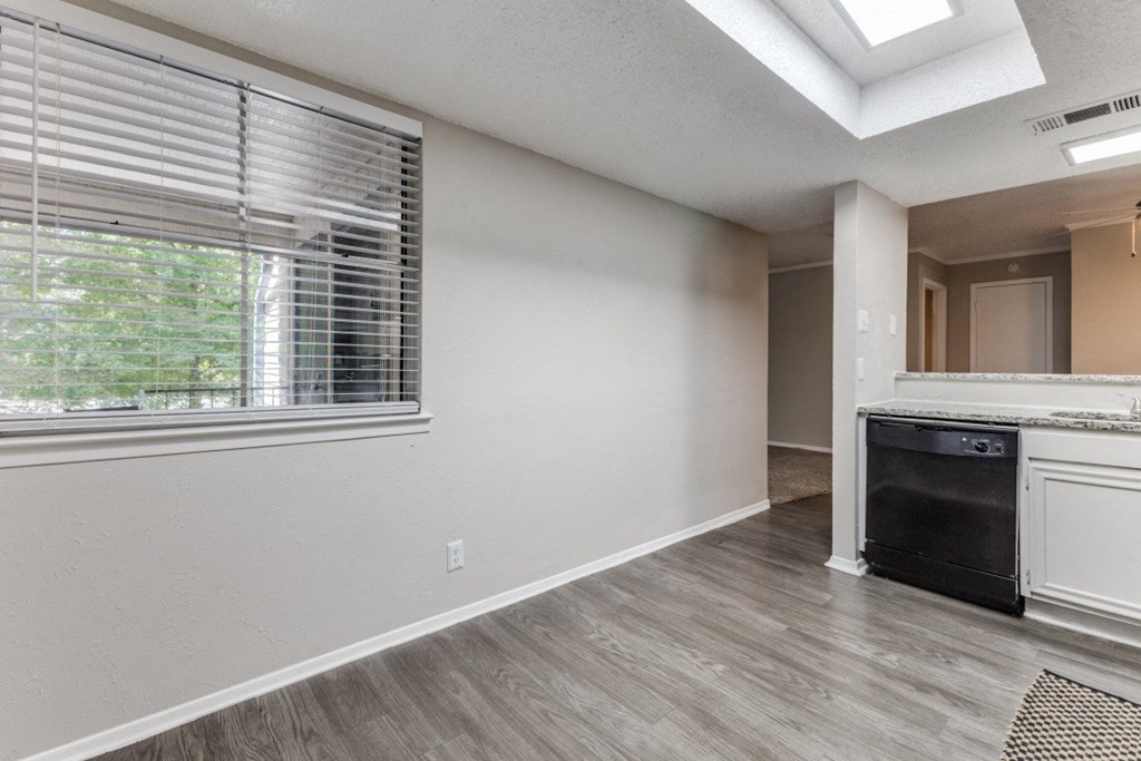 a kitchen and living room with a large window