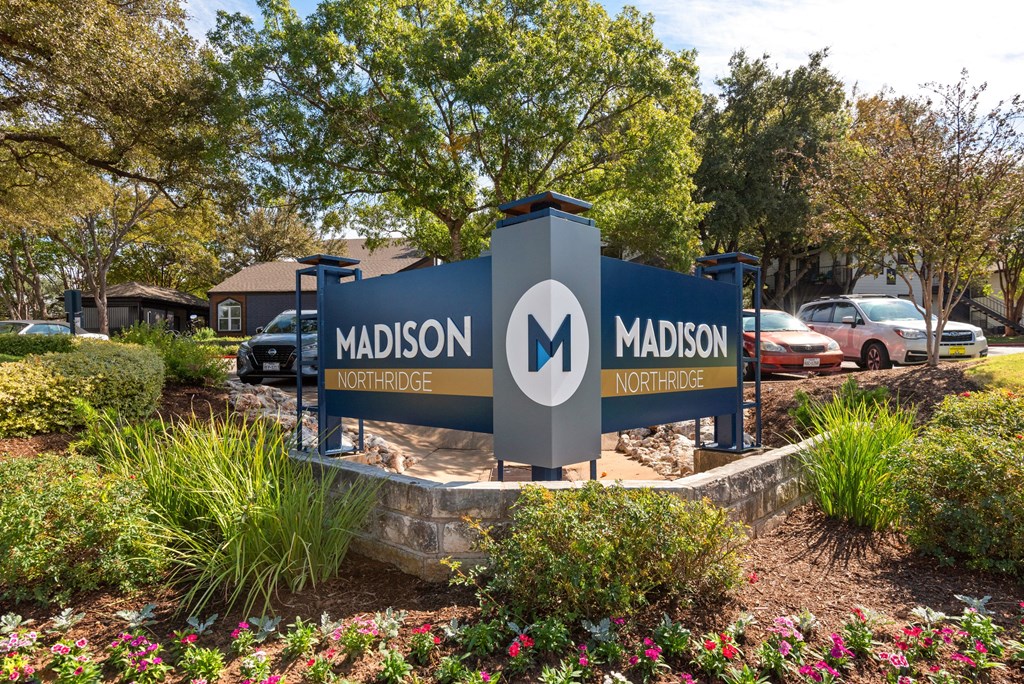 a sign in front of a building