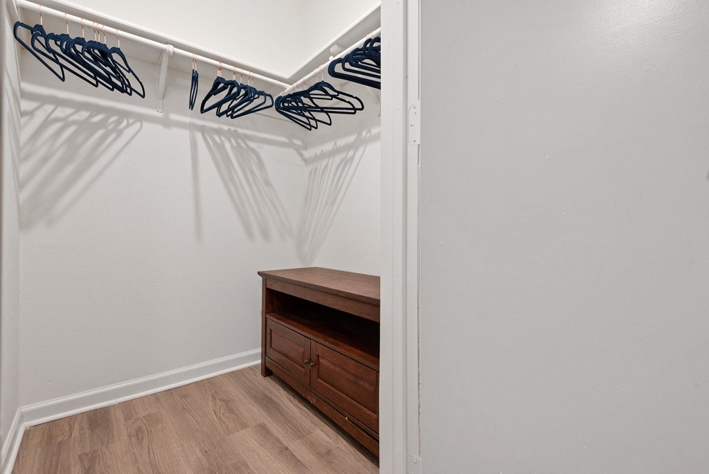 a walk in closet in a 555 waverly unit