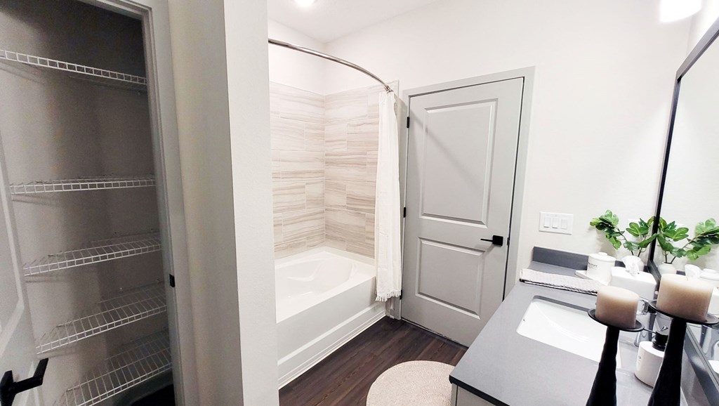 a bathroom with a shower and a sink