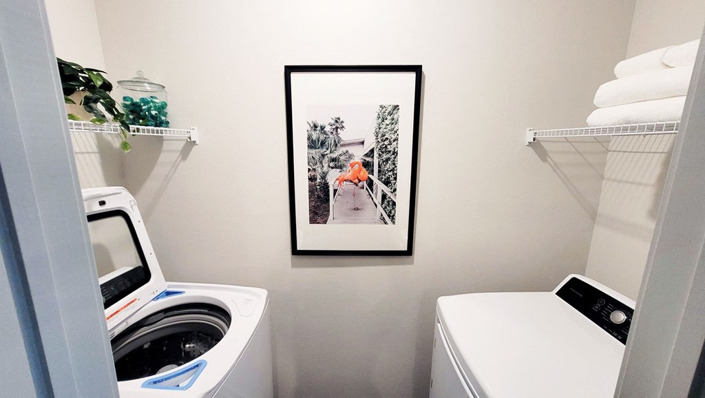 a small laundry room with a washer and dryer