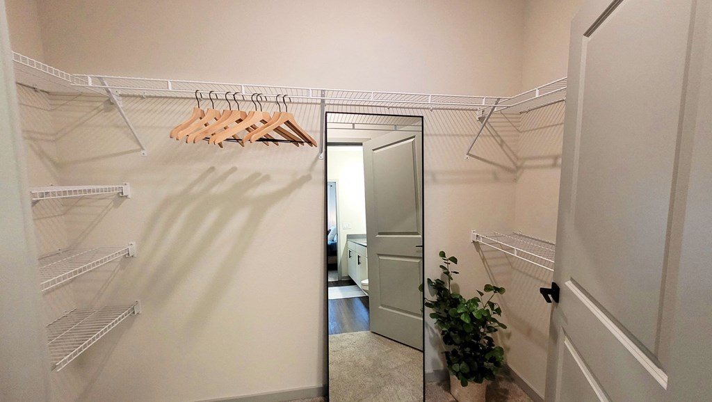 a walk in closet in a 555 waverly unit