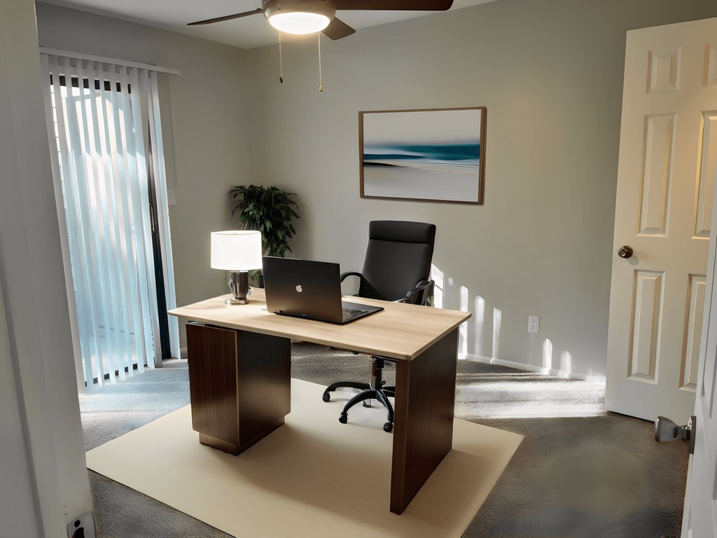 a home office with a desk and a laptop