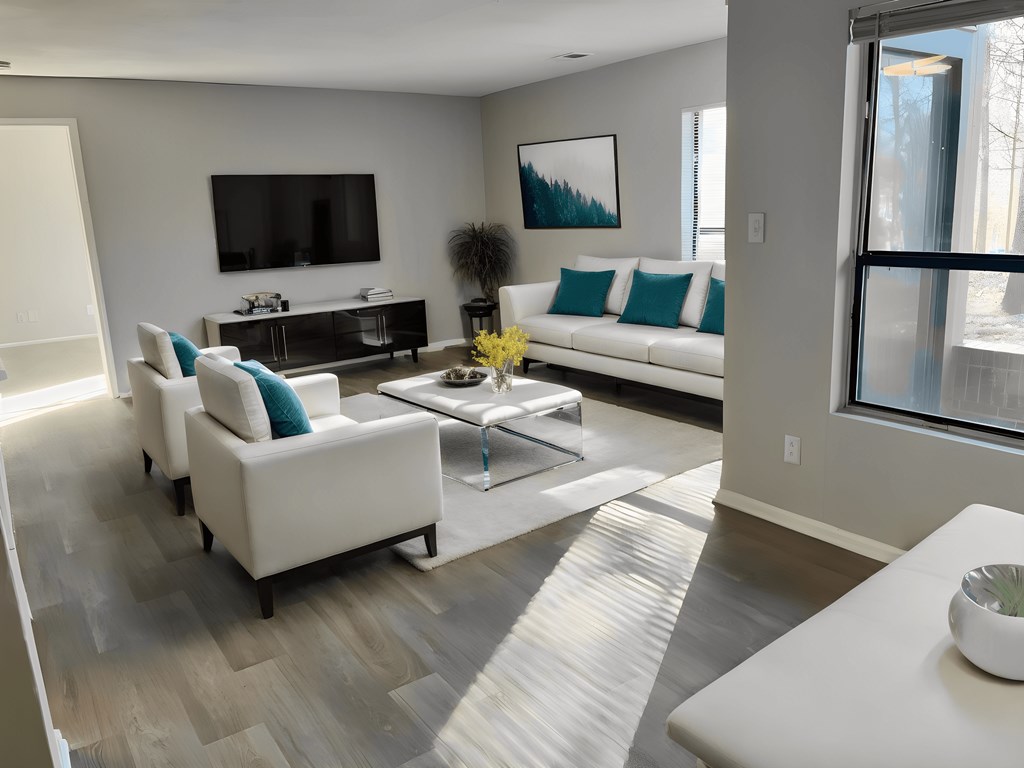 a living room with couches and chairs and a television