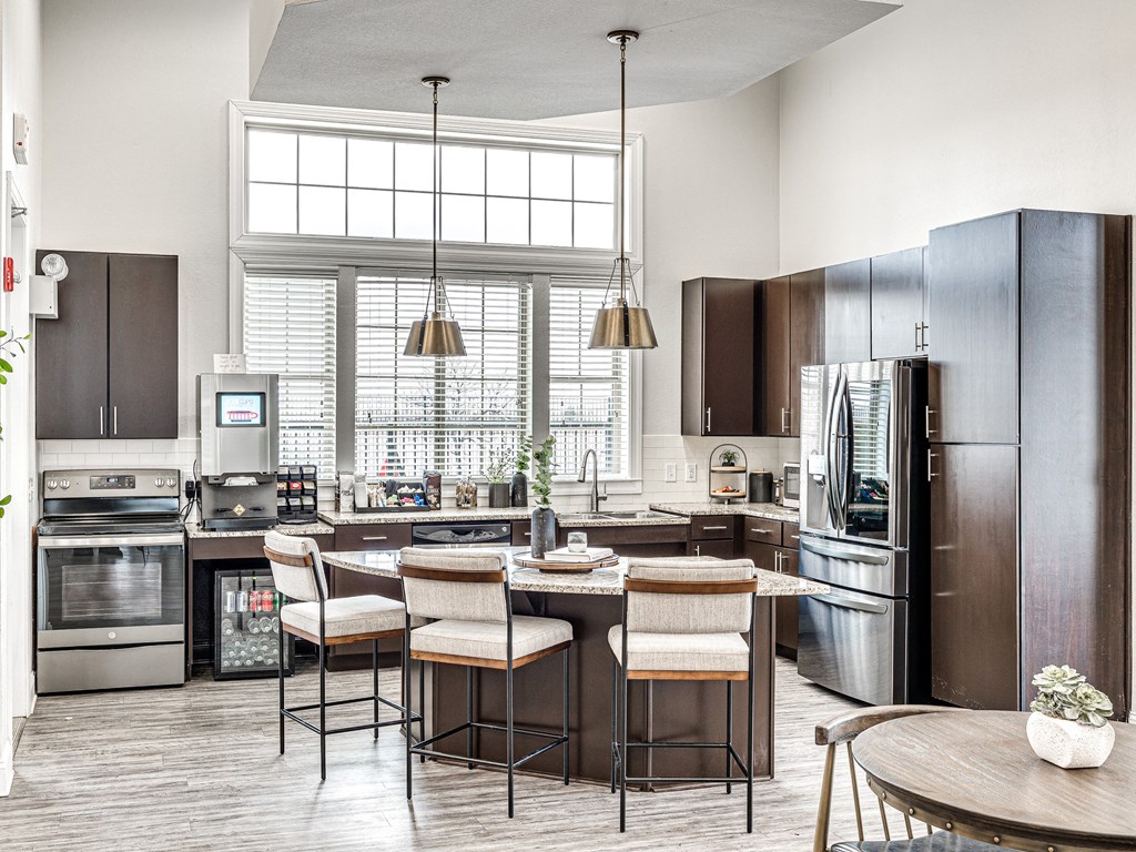 a kitchen with stainless steel appliances and a large window