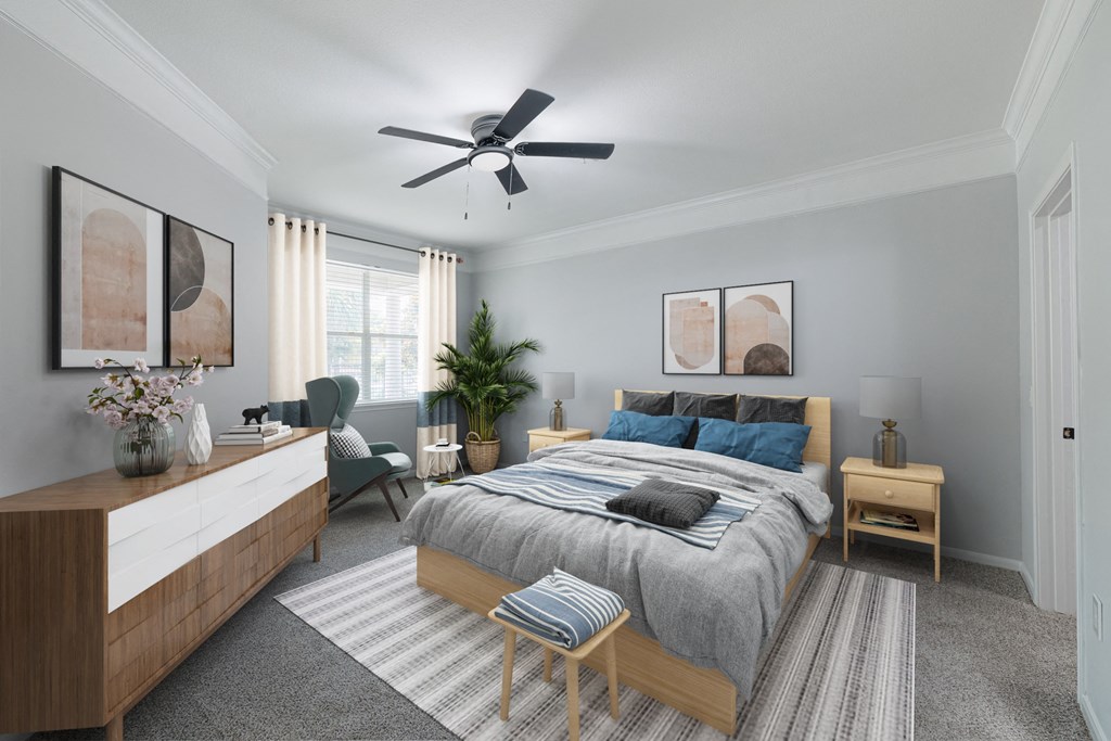a bedroom with a large bed and a ceiling fan