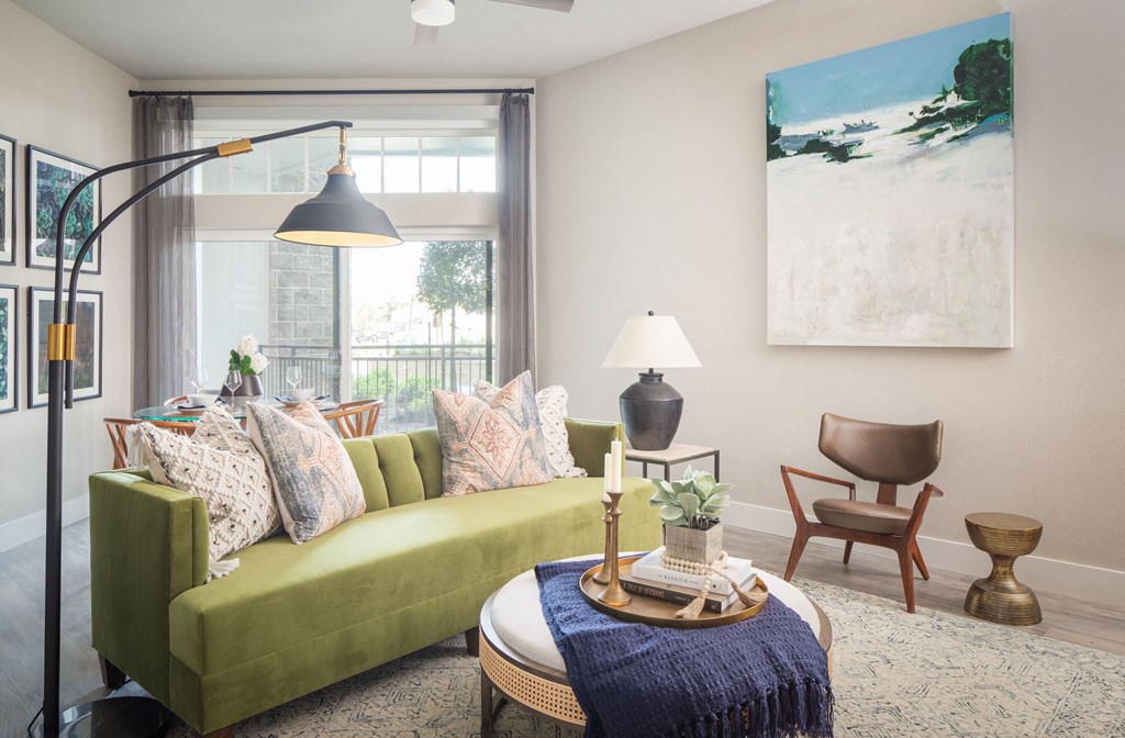 a living room with a green couch