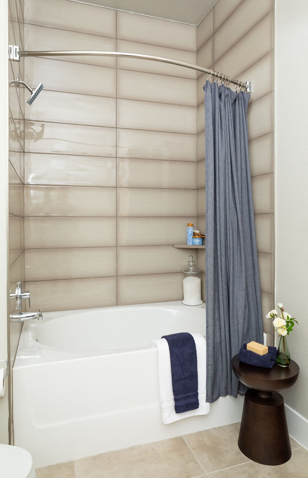 a bathroom with a white tub and a shower curtain