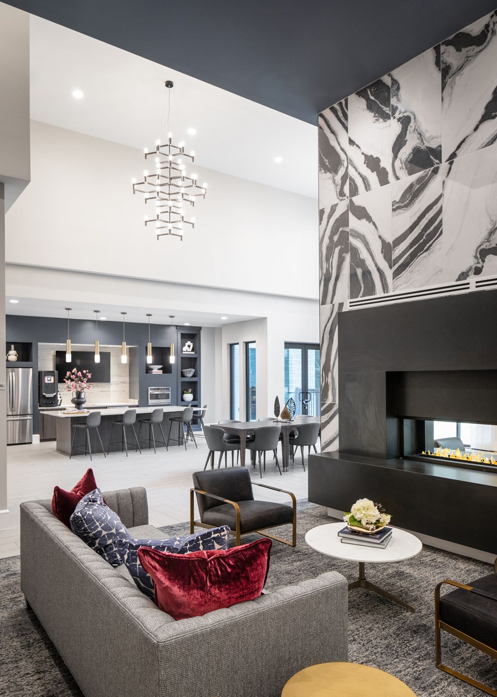 a living room with a couch and chairs and a fireplace