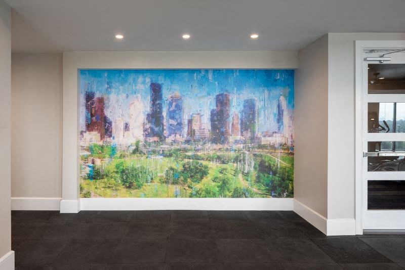 a large painting on a wall in a room