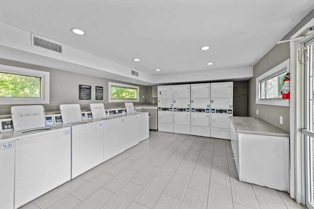 the laundry room is equipped with washers and dryers