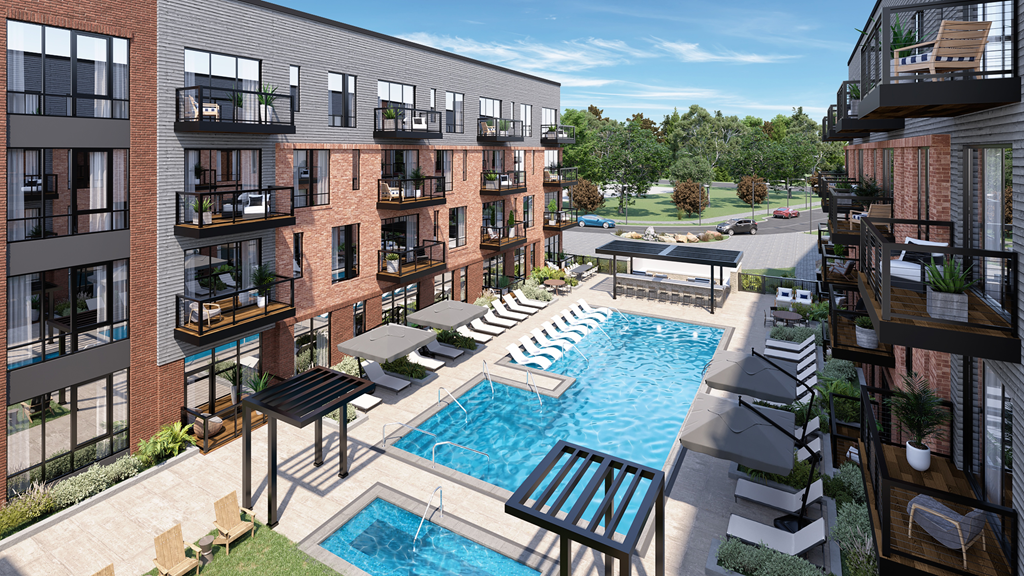 an aerial view of an apartment complex with a swimming pool