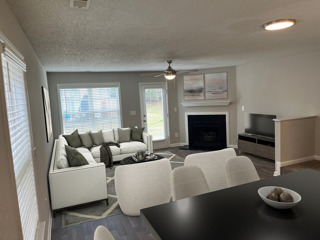 a living room with a couch and a table and a fireplace