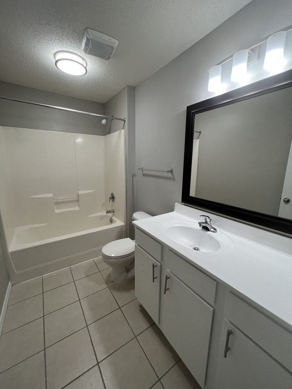 a bathroom with a sink and a toilet and a shower