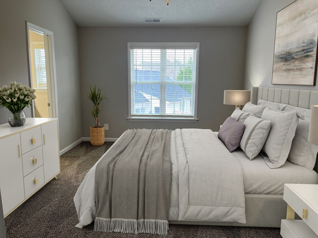 a bedroom with a large bed and a window