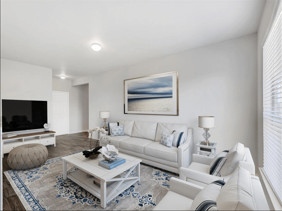 a living room with a couch and a tv