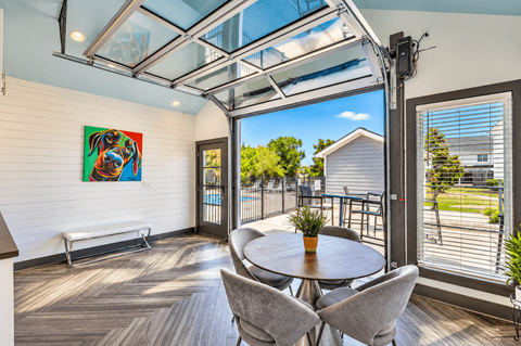 A room with a glass ceiling and a table with chairs.