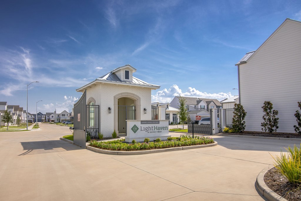 The image shows the entrance to Light Haven with a clear blue sky above.